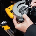 Hands using a hex key from the Tolsen 9pcs long arm hex key set to adjust a power tool