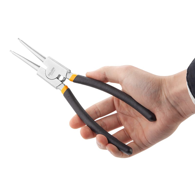 Close-up of hand holding Tolsen 9 inch external straight circlip pliers