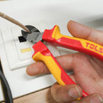 Using insulated diagonal cutting pliers from Tolsen 15Pcs Insulated Hand Tools Set to cut wire