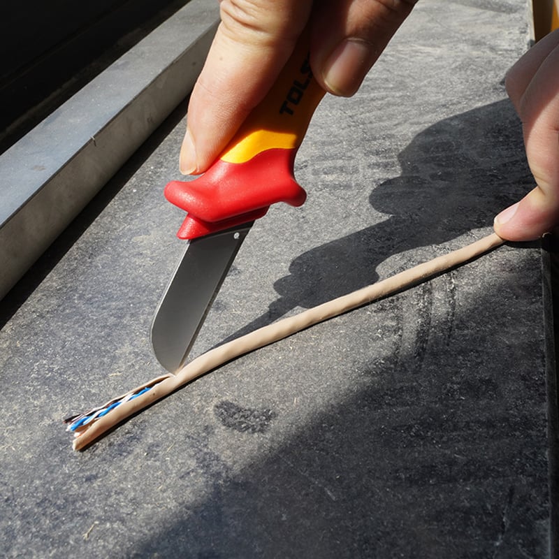 Using insulated knife from Tolsen 15Pcs Insulated Hand Tools Set to strip cable