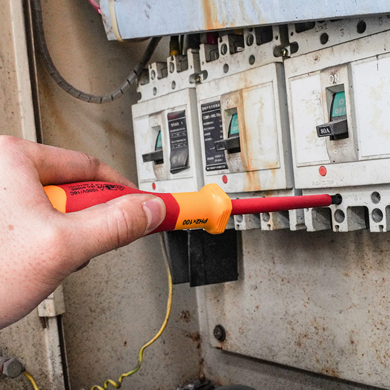 Using insulated screwdriver from Tolsen 15Pcs Insulated Hand Tools Set on electrical panel