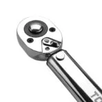 Close-up of the reversible ratchet head mechanism and quick-release button on Tolsen torque wrench.