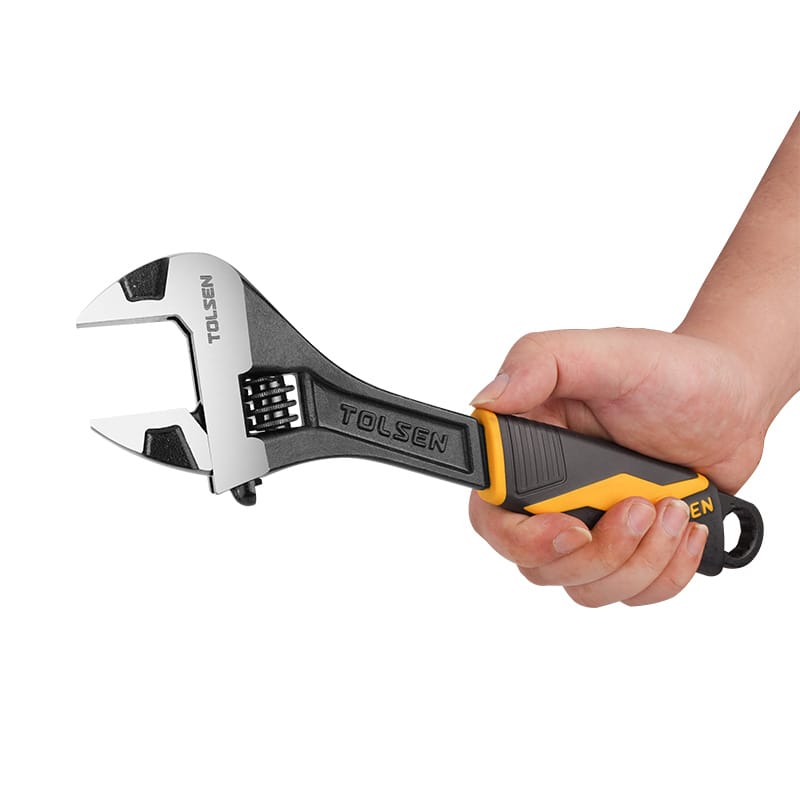 Close-up of a hand holding a Tolsen 12 inch adjustable wrench