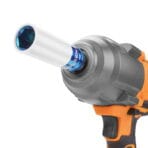 Close-up view of a Tolsen 1/2" drive impact socket with protective sleeve attached to a cordless impact wrench gun