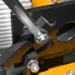 Using a TOLSEN 19mm combination spanner to tighten a bolt on a heavy metal structure