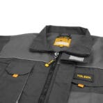 Close-up of TOLSEN Working Jacket showing branded zipper pull, chest pocket with yellow tab, and inner brand label
