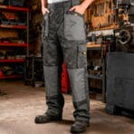 Worker wearing multi-pocket TOLSEN Working Trousers with reinforced knees in a workshop environment