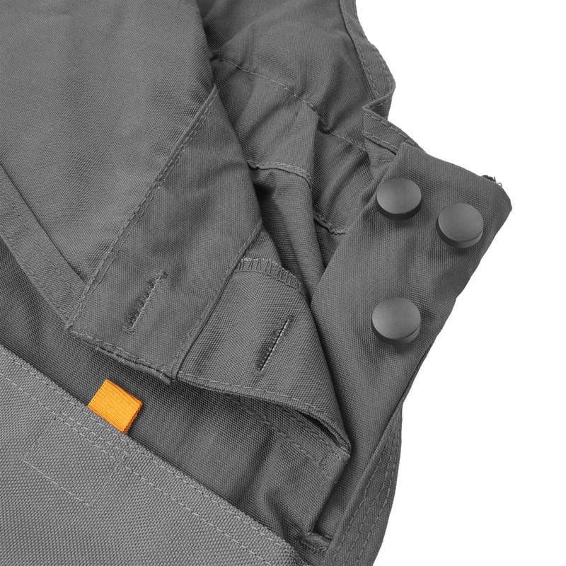 Detail of the side waist snap fasteners and fabric texture, allowing for a custom fit on Tolsen working overalls.