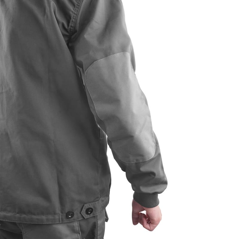 Side view of Tolsen protective jacket worn by a model, highlighting the reinforced elbow patch.