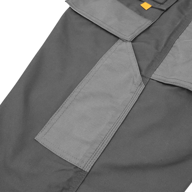 Close-up of the reinforced grey knee pad pockets on Tolsen working trousers designed for heavy-duty protection.