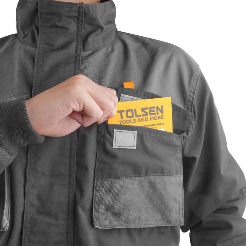 Close-up of Tolsen utility jacket chest pocket holding a small notebook or manual.