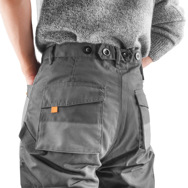 Rear view of Tolsen work trousers showing the back pockets and fit around the waist.