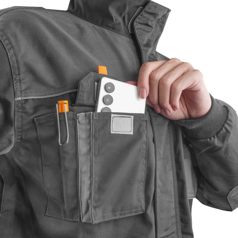 Tolsen workwear jacket chest pocket with dedicated space for a smartphone and pen holder.