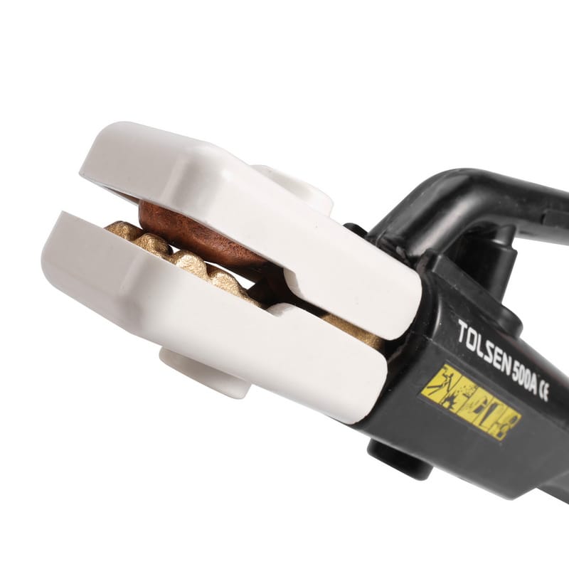 Close-up detail of Tolsen 500A welding stinger jaws, showing the durable copper clamping mechanism and multi-angle grooves for holding electrodes.