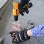 Tolsen 12V Cordless Drill drilling into brick