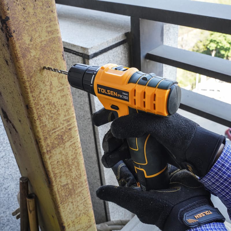 Tolsen 12V Cordless Drill drilling into metal beam