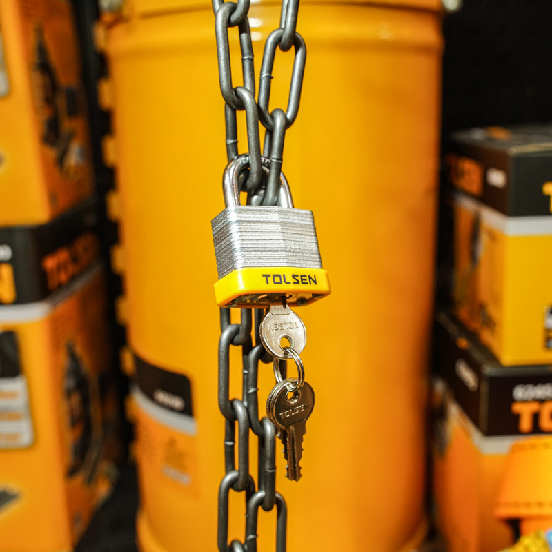 Tolsen Laminated Padlock shown securing a metal chain with keys hanging