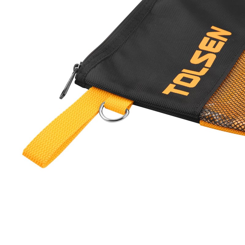 Close-up of the corner of the TOLSEN tool bag, showing the zipper pull and yellow hanging strap