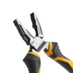 Extreme close-up of the TOLSEN High-Leverage Combination Pliers head, detailing the precision-machined serrated jaws, pipe grip, wire cutter, and EZ industrial engravings.