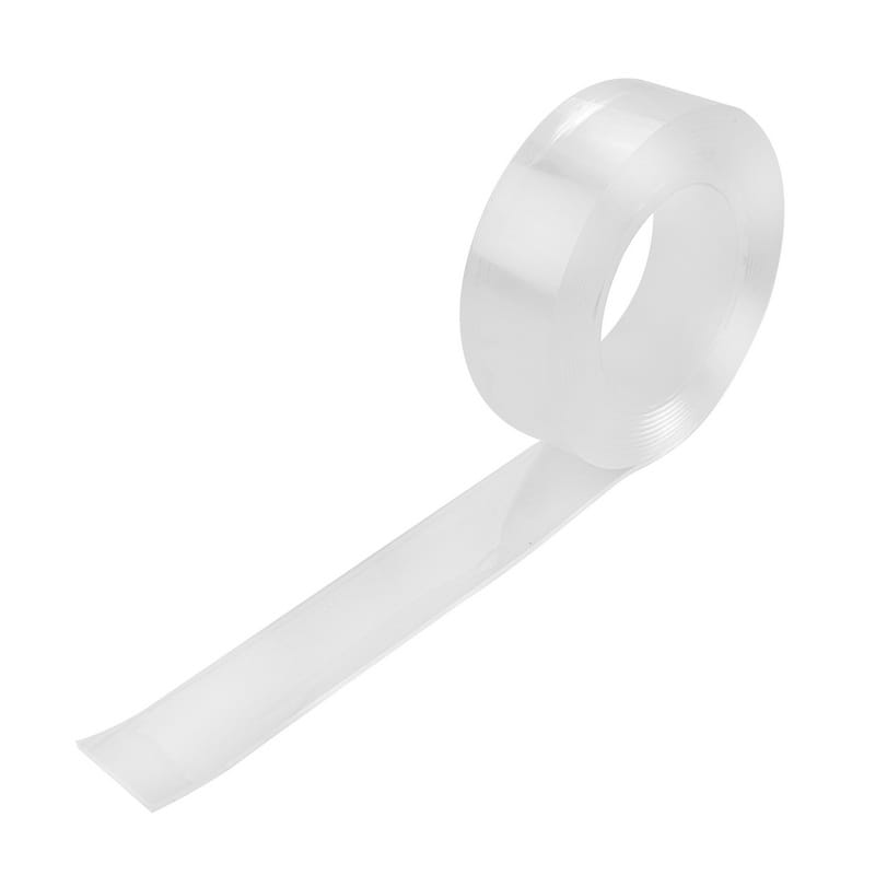 Angled view of an unrolled roll of TOLSEN clear double sided nano tape, showing its transparent and flexible gel material.